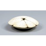 MAGGIE BARNES (born 1940); a stoneware disc form with five section top, made in the early 1980s,