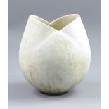 JOHN WARD (born 1938); a stoneware tulip vessel covered in mottled cream glaze, impressed JW mark,