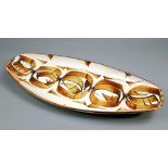 ALAN CAIGER-SMITH (born 1930) for Aldermaston Pottery; an elongated tin-glazed earthenware tray,