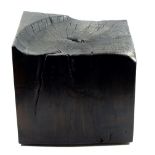 AUDREY HAYES; a 'Bum Cube' stool of scorched lime wood, height 42cm.