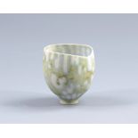 MARY ROGERS (born 1929); a small porcelain footed vase, abstract pattern on stippled ground,