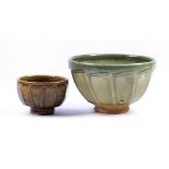 RICHARD BATTERHAM (born 1936); a cut-sided stoneware footed bowl covered in green ash glaze,