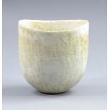 JOHN WARD (born 1938); an oval stoneware vessel covered in mottled matt cream glaze,