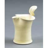 TAKESHI YASUDA (born 1943); a tall creamware milk jug, potter's label, height 15cm.