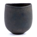 JOHN WARD (born 1938); an oval stoneware vessel covered in matt black glaze, impressed JW mark,