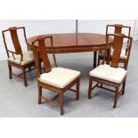 A contemporary Chinese hardwood extending dining table,