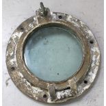 A bronze hinged ship's portal bearing tie on label from Humberts Ship Repairers Ltd,