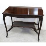 An Edwardian mahogany side/hall table with shelf stretcher to tapering cabriole supports and peg