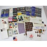 A collection of mid-20th century stamps and first day covers, some in plastic sleeves.