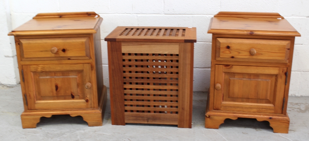 A pair of modern yellow pine bedside cabinets, 62 x 51cm and a lattice laundry box, 55 x 52cm (3).