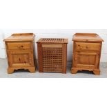 A pair of modern yellow pine bedside cabinets, 62 x 51cm and a lattice laundry box, 55 x 52cm (3).