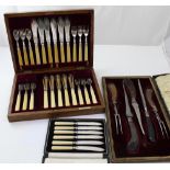 A late 19th/early 20th century part canteen of thick ivory-handled fish flatware,