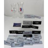 A collection of ships' engine control lever glasses marked slow, dead slow, half and full,
