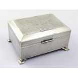 A George V hallmarked silver cigarette box with all-over engine-turned decoration,