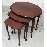 A nest of three mahogany tables, tapering cabriole supports and pad feet, length 57cm.