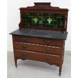 An Edwardian walnut tile-back black slate washstand with two-over-two drawer base,