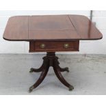 A Regency mahogany Pembroke table, central carved column to quadripartite supports on castors,