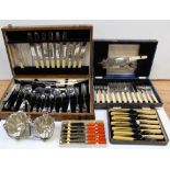 An oak cased canteen of plated cutlery, two cased sets of fish knives and forks,