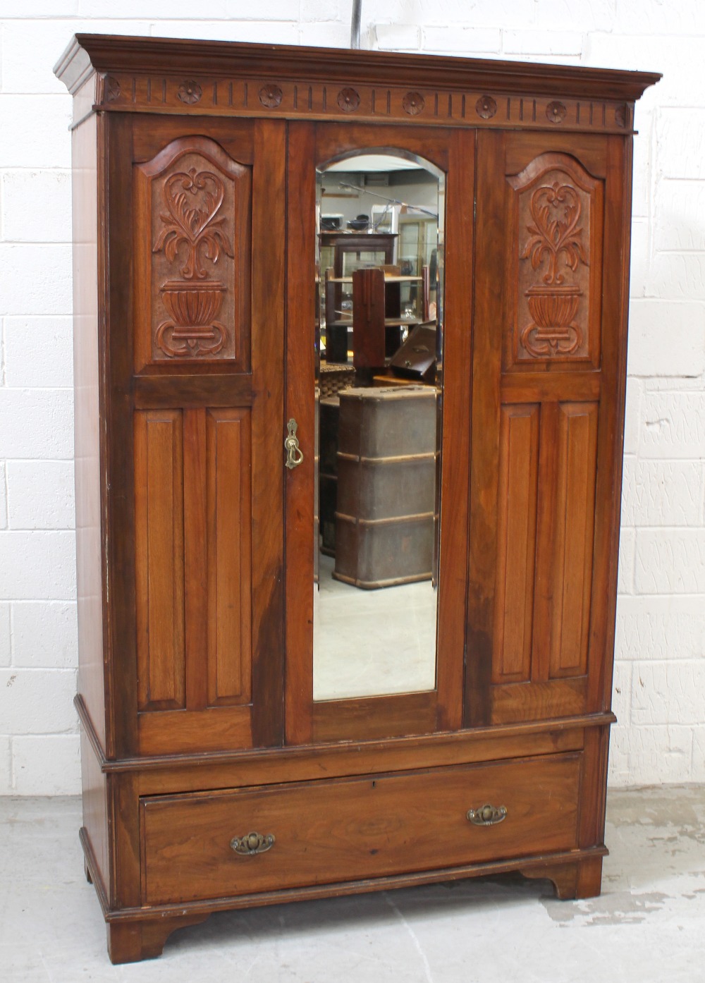 A Victorian red walnut mirror-door wardrobe,