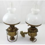 A pair of late 19th/early 20th century brass gimbal-mounted ship's oil lamps,