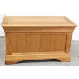 A modern light oak blanket box/ottoman, 52 x 90cm.