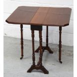 A late 19th early 20th century walnut Sutherland table, six turned supports with cross-stretcher,