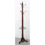 A 20th century Regency-style mahogany hall tree with brass umbrella stand,