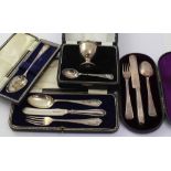 A small collection of hallmarked silver Christening sets to include an Elizabeth II silver egg cup