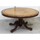 A Victorian walnut and inlaid circular table on spreading legs to castors, diameter approx 137cm.