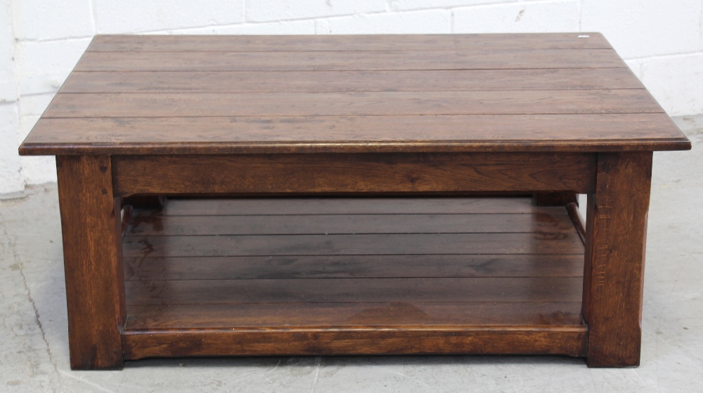 A large modern distressed oak coffee table with shelf stretcher, 36 x 120cm.