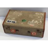 A vintage travel case with 'White Star New York Cunard Line First Class',