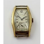 A West End Watch Co rolled gold cased tonneau-shaped ladies' wristwatch with Arabic and baton