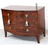 A George III bow-front chest, two drawers over two lower drawers, to splayed bracket supports,