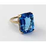 A 9ct ladies' dress ring set with large cushion-cut blue stone (possibly spinel), size O, approx 9g.