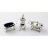 A George V hallmarked silver three-piece cruet comprising salt, mustard pot and pepperette,