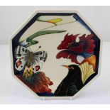 A boxed Moorcroft octagonal dish decorated with butterflies and flowers,