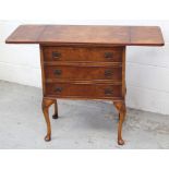 A Berban Funnell reproduction walnut and beech drop-leaf cabinet, three doors to cabriole supports,