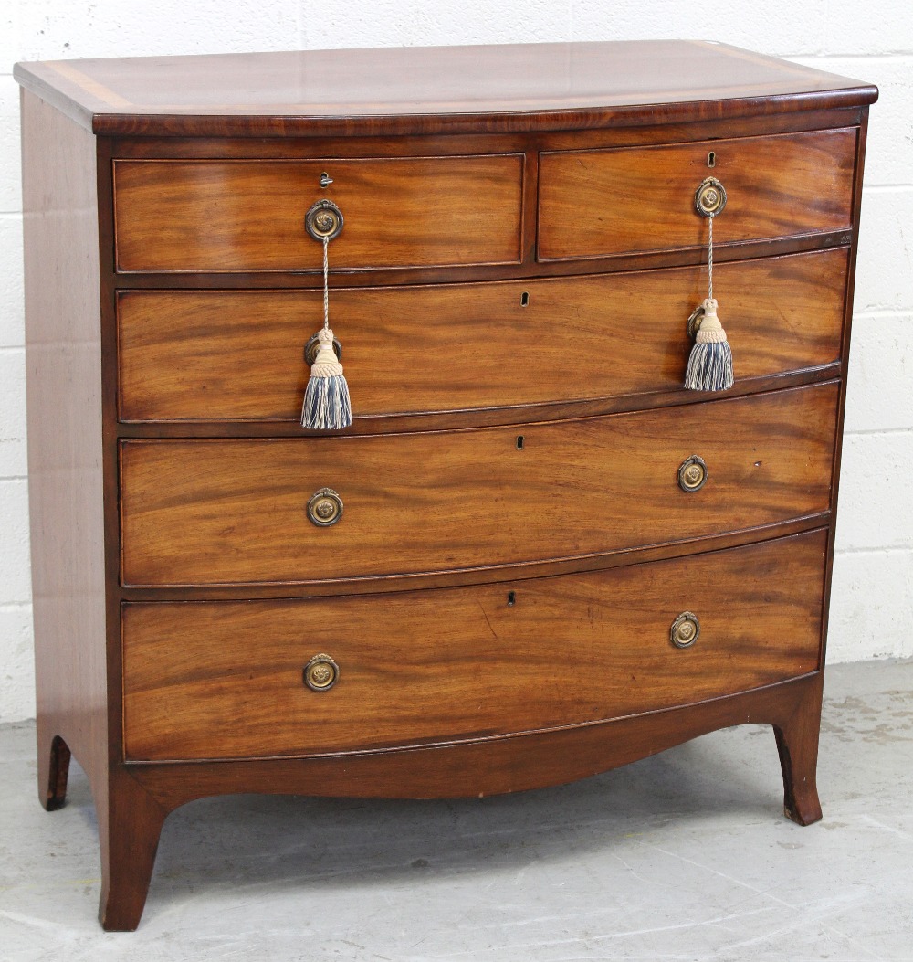 A George III inlaid mahogany bow-front chest of two-over-three drawers to splayed supports,