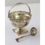 A George V hallmarked silver pedestal sugar basket with swing arm, Thomas Bradbury & Sons,