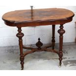 A Victorian walnut centre table, carved turned supports to crinoline cross-stretcher on castors,