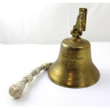 A brass ship's bell inscribed 'Craig JM Carter Editor 'Sea Breezes' 1962-1986',