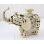 A Meiji period Mughal-style ivory elephant decorated in Shibayama style with semi-precious stones,