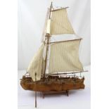 A scratch-built model galleon with miniature brass canons and five sails, approx length 75cm.