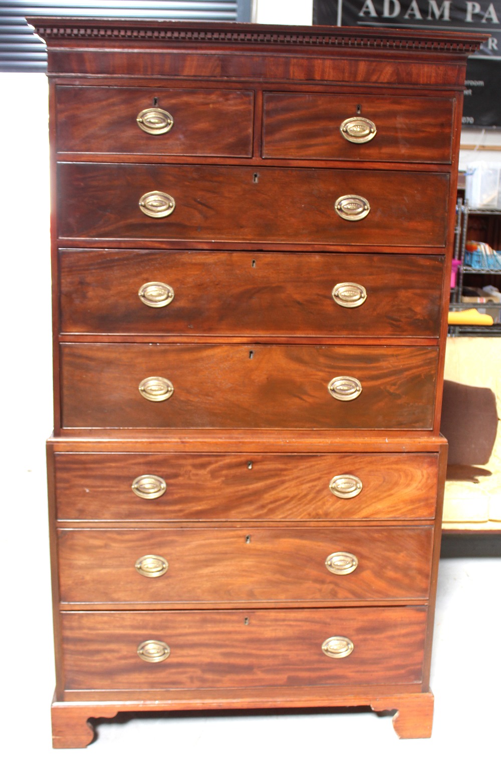 A George III mahogany chest-on-chest tallboy, Greek key frieze over two drawers,
