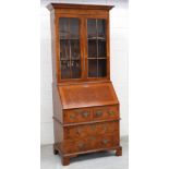 A walnut 18th century style bureau bookcase,