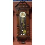 A mahogany cased three weight Vienna style wall clock,