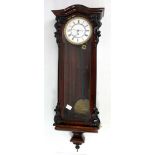 A late 19th century rosewood and simulated rosewood single weight Vienna style wall clock,