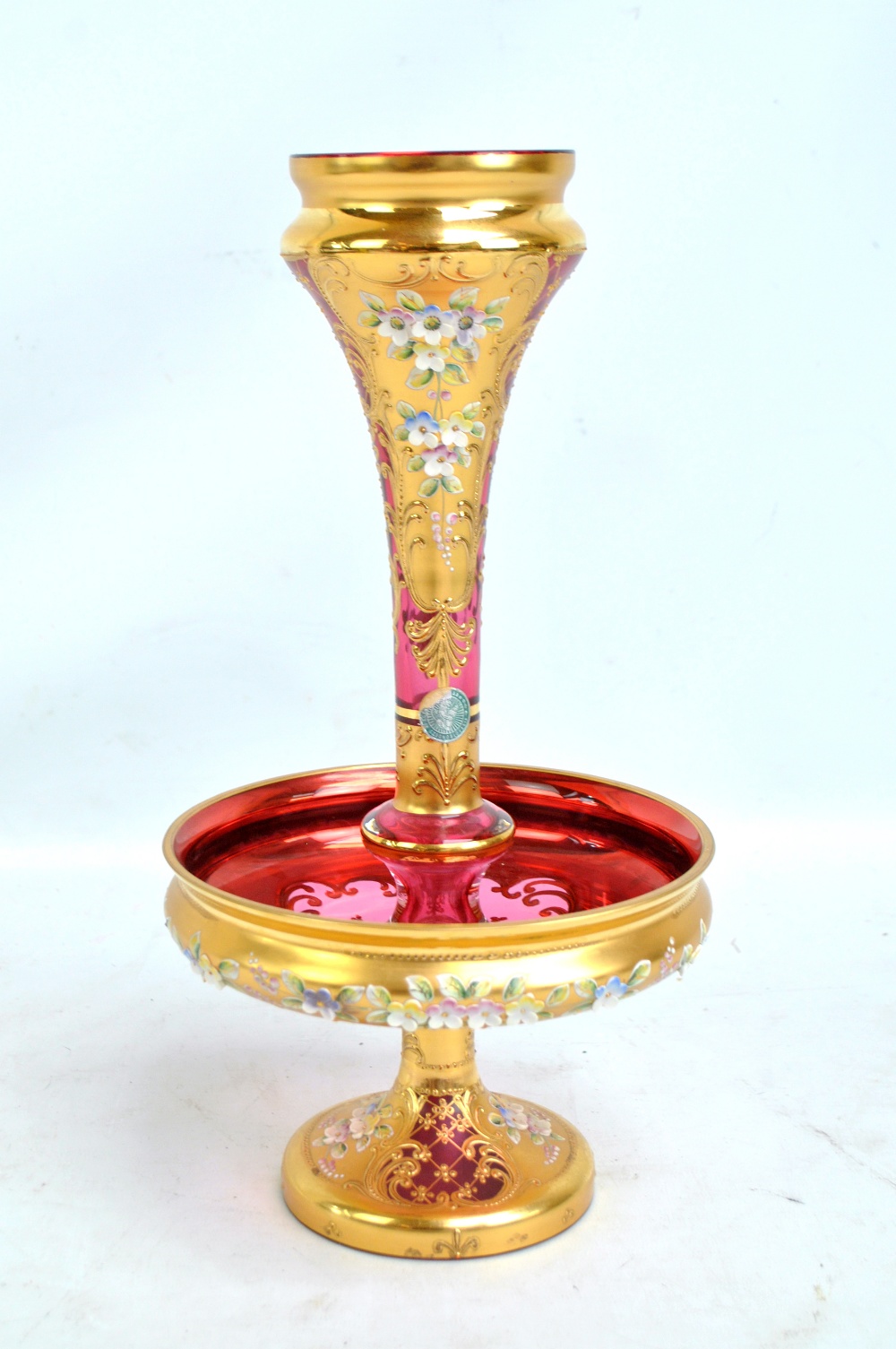 A Czechoslovakian cranberry glass heavy gilt floral decorated single horn epergne of tapering form