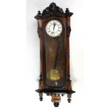 A circa 1900 walnut and ebonised Vienna style single weight wall clock,