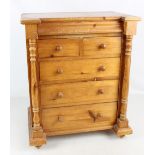 A pine sewing box modelled as a Scotch chest with two short over three long drawers, height 55cm.